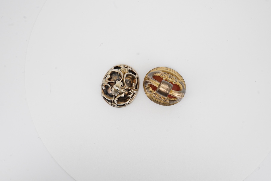 Two antique gilt metal and carnelian set fob seals, one matrix carved with the name 'James', the other 'Lamova' with a rose, 27mm et infra. Condition - poor to fair